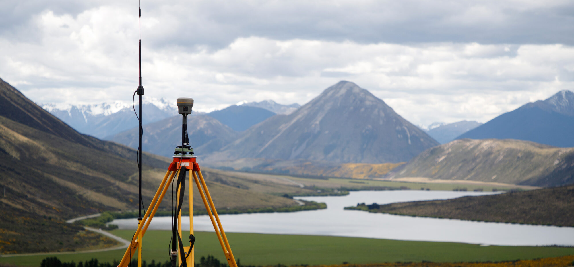 View of landscape with survey equipment in the field