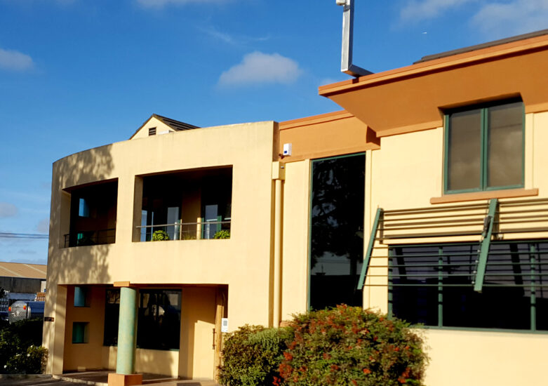 Photo of a commercial building on a blue sky & sunny day
