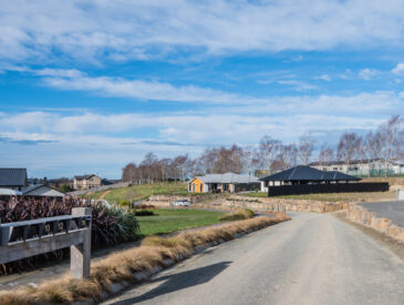 Photo of a residential development with blue sky in the background
