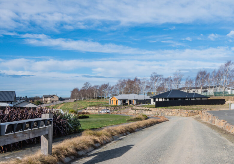 Photo of a residential development with blue sky in the background