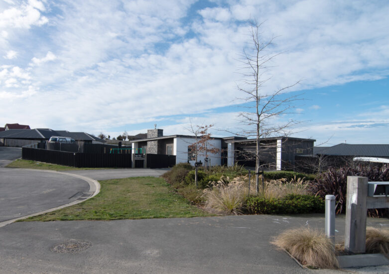 Photo of a residential development with blue sky in the background
