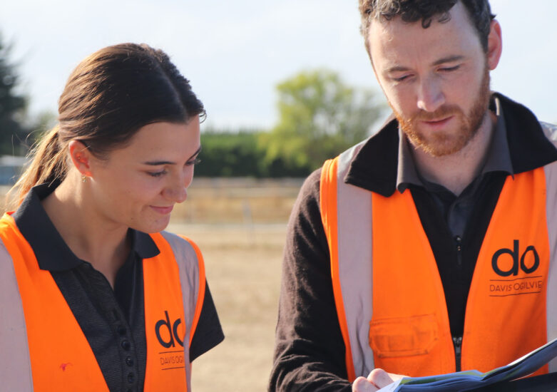 Two people dressed in high visibility vests