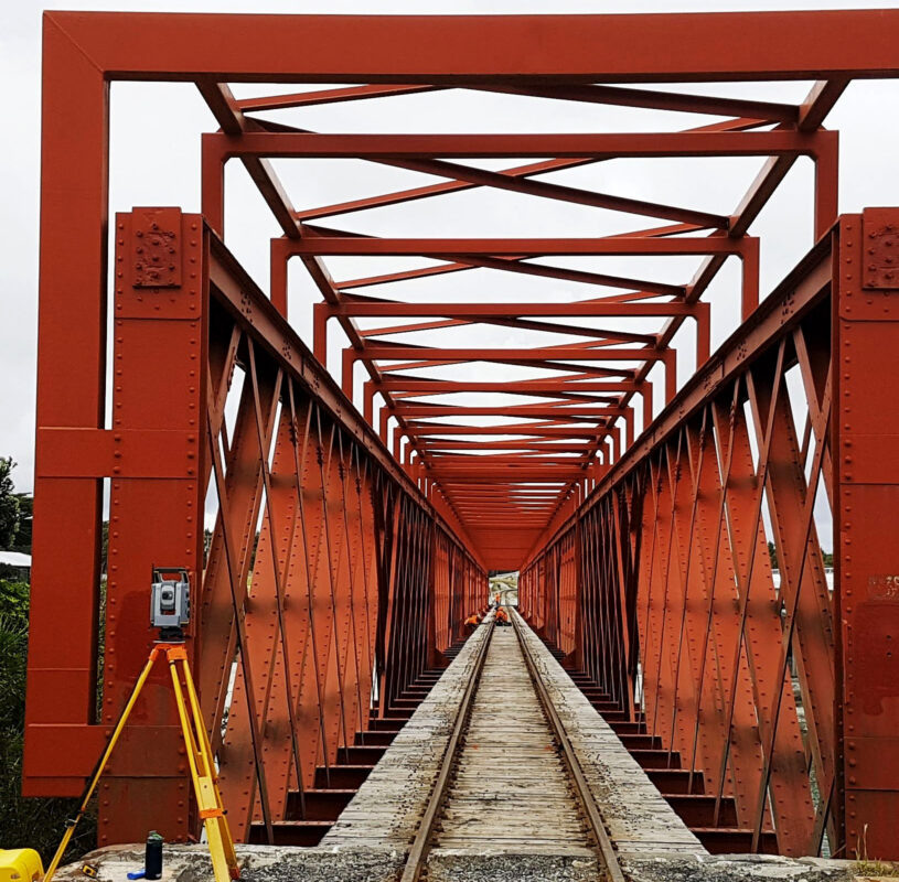 View of a railway bridge and survey equipment beside