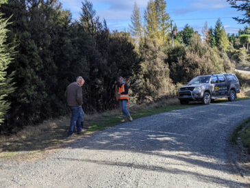 View of surveying equipment and team working in alpine area