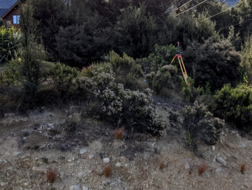 View of surveying equipment and team working in alpine area