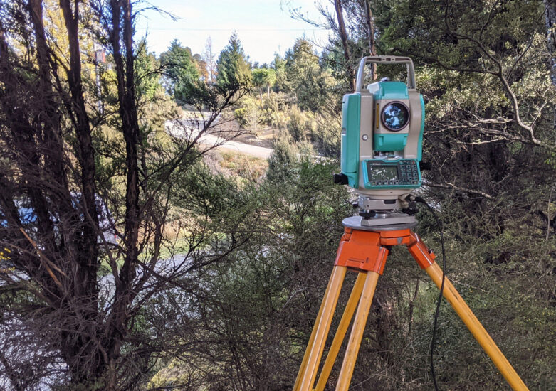 View of surveying equipment in rugged bush