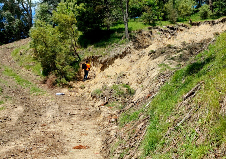 View of damage on land due to landslides post weather events.