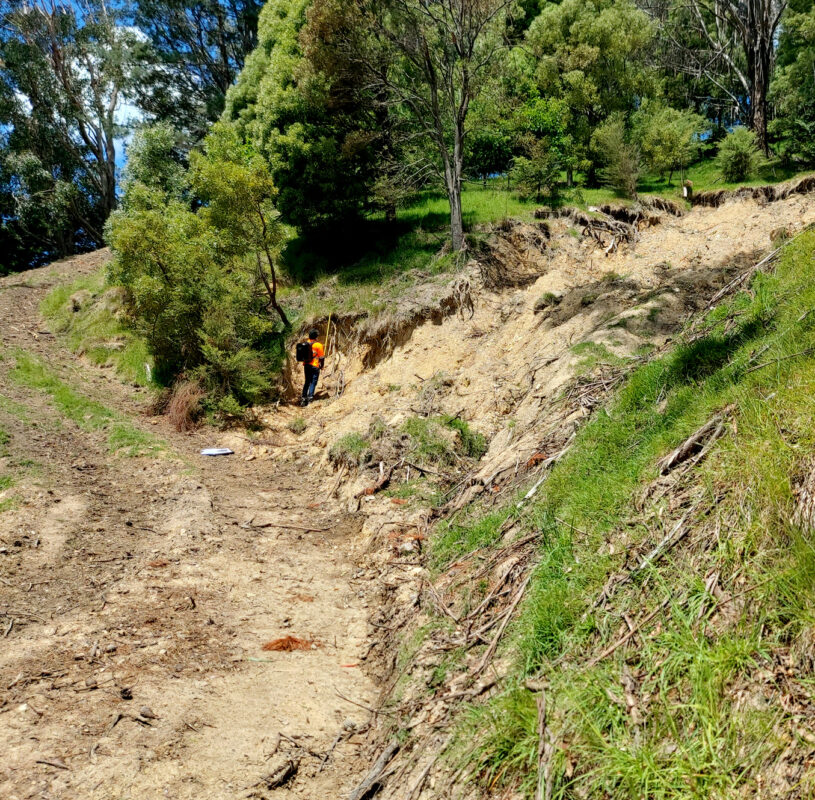 View of damage on land due to landslides post weather events.