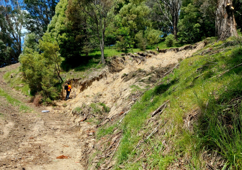View of damage on land due to landslides post weather events.