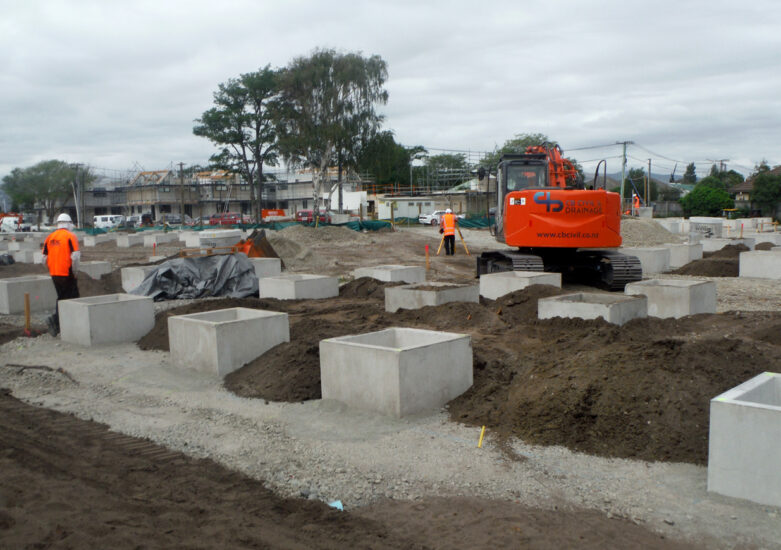 Construction in progress with concrete structures in open land