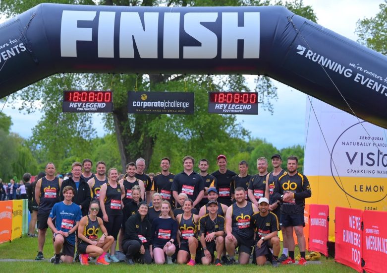 Team of people at the finish line of a running and walking event.